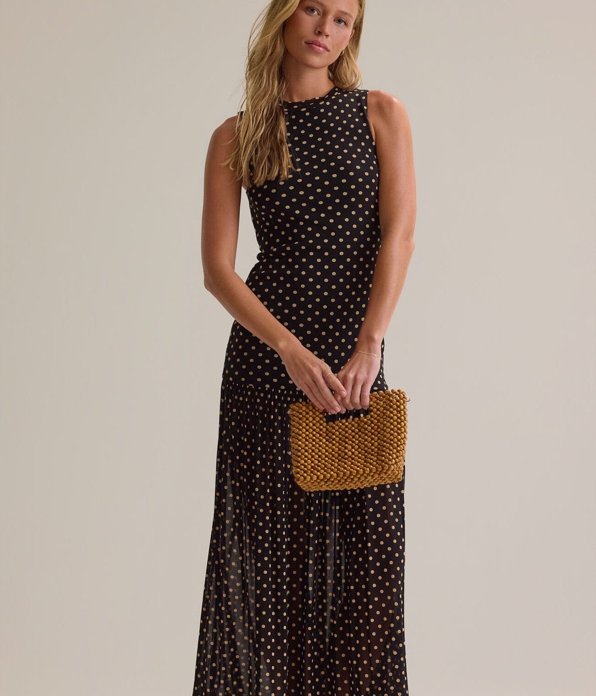 A model wearing a polka dot maxi dress